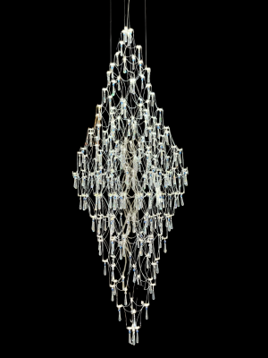 Elegant cascading crystal chandelier with integrated 24V LED lighting and adjustable suspension cables. Ideal for staircasesn & double-volume living rooms.